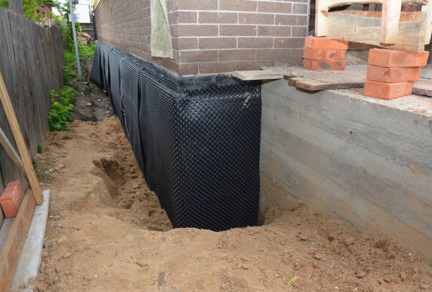 SJ Waterproofing Pros technician performing targeted Exterior Waterproofing assessment in Hickory Corners, MI